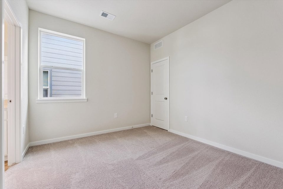 A room with a door and a window.