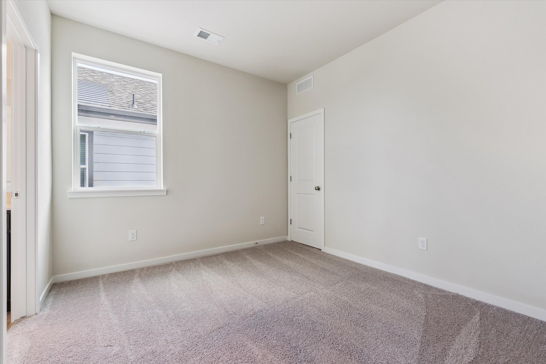 A room with a door and a window.