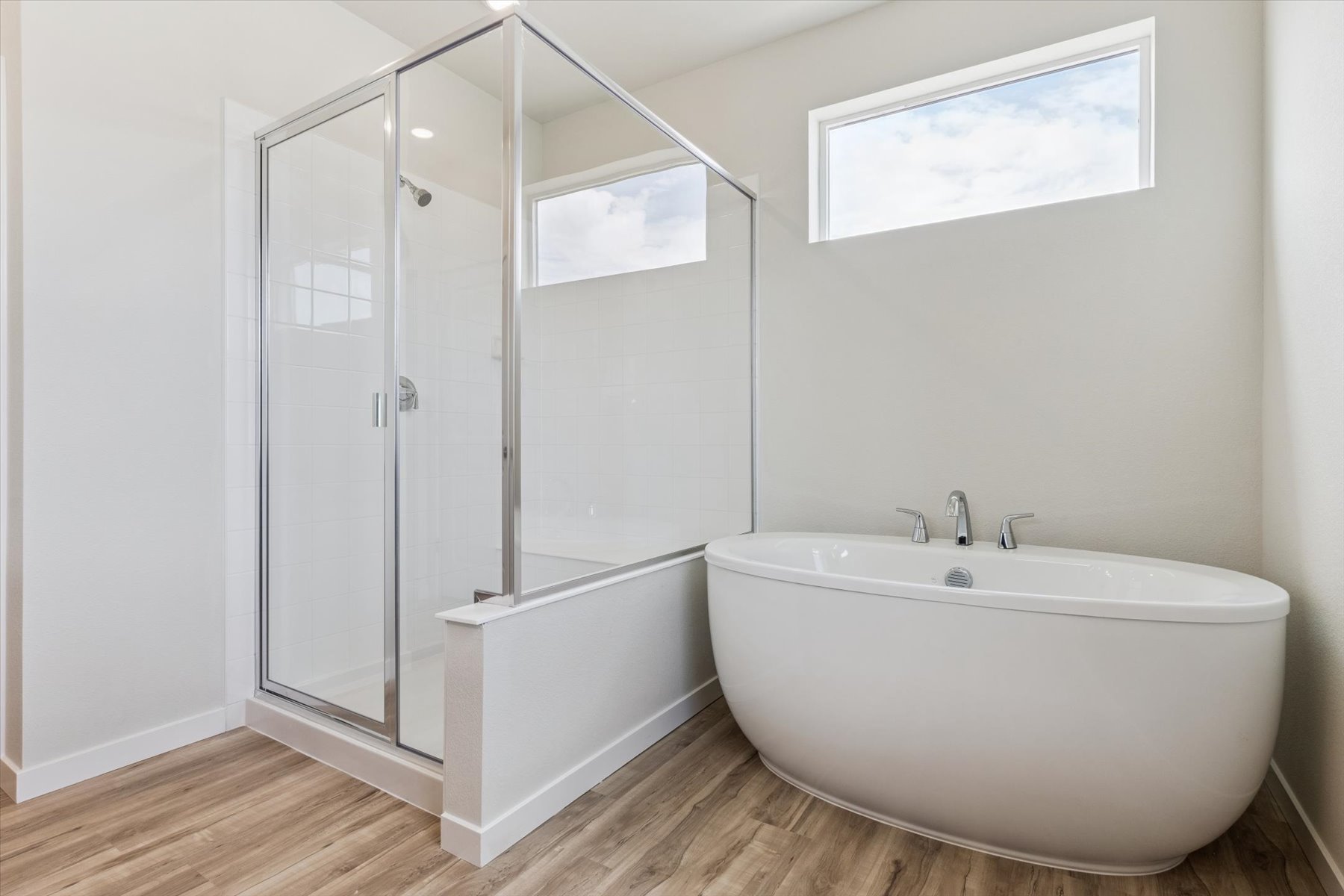 A bathroom with a glass shower.