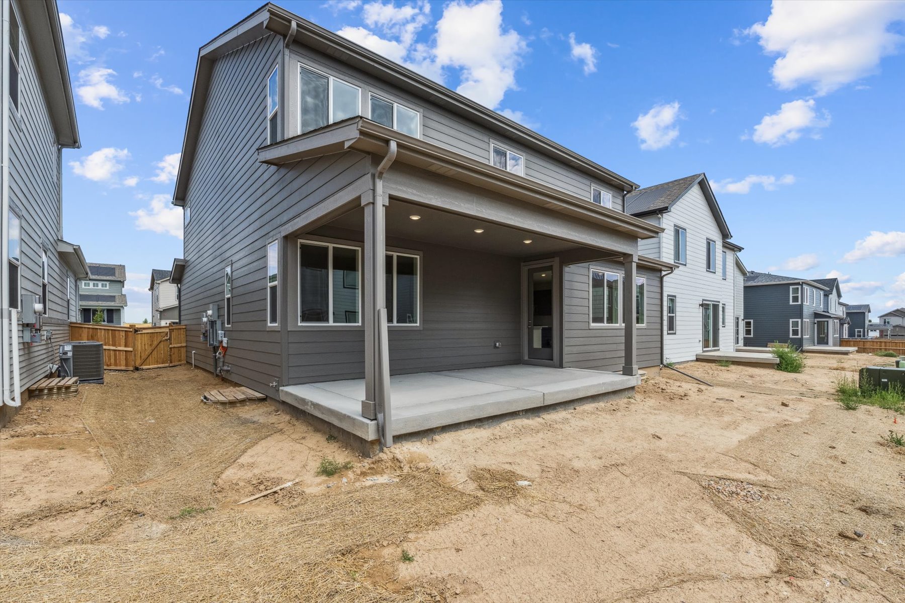 A house with a dirt yard.