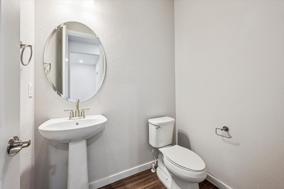A bathroom with a sink and toilet.