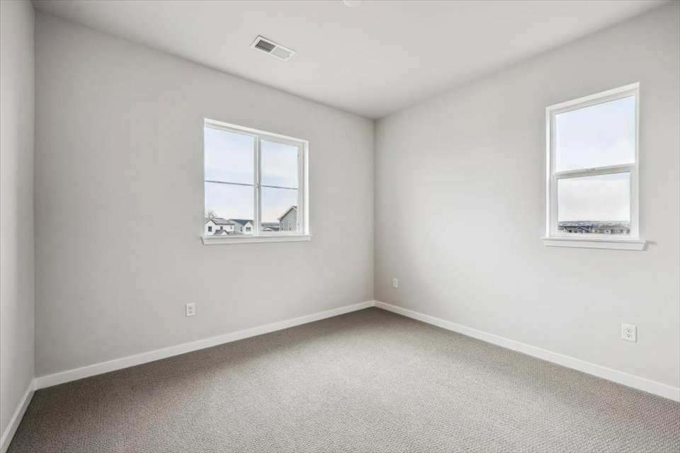 A room with white walls and windows.