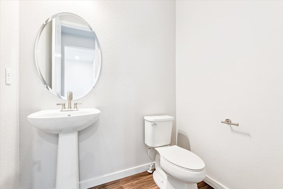 A bathroom with a sink and toilet.