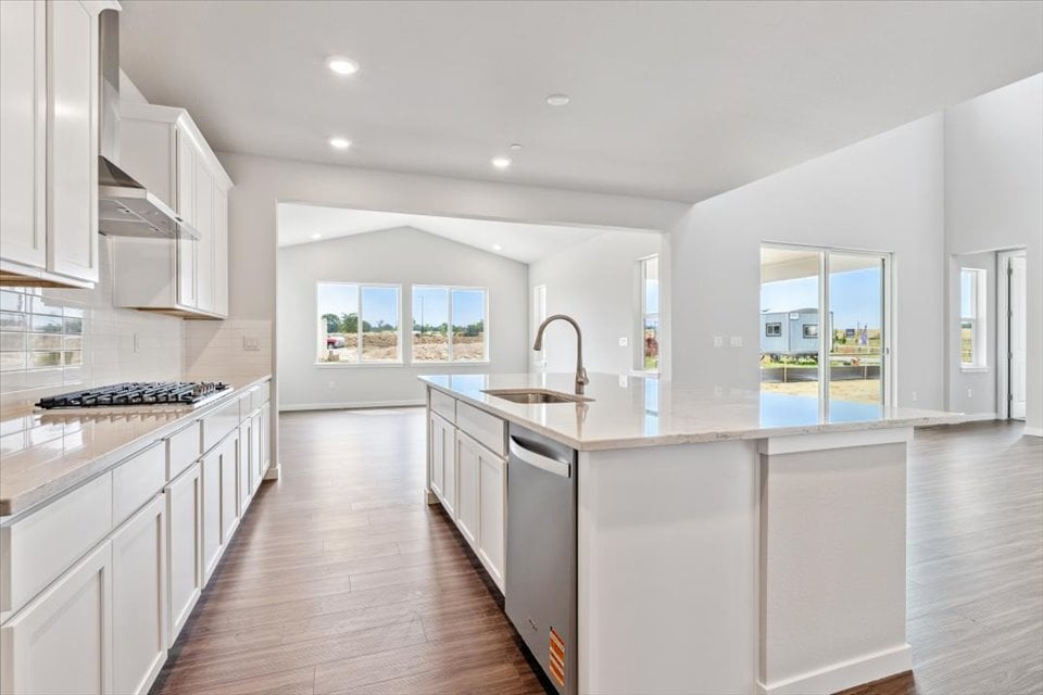 A kitchen with white cabinets.