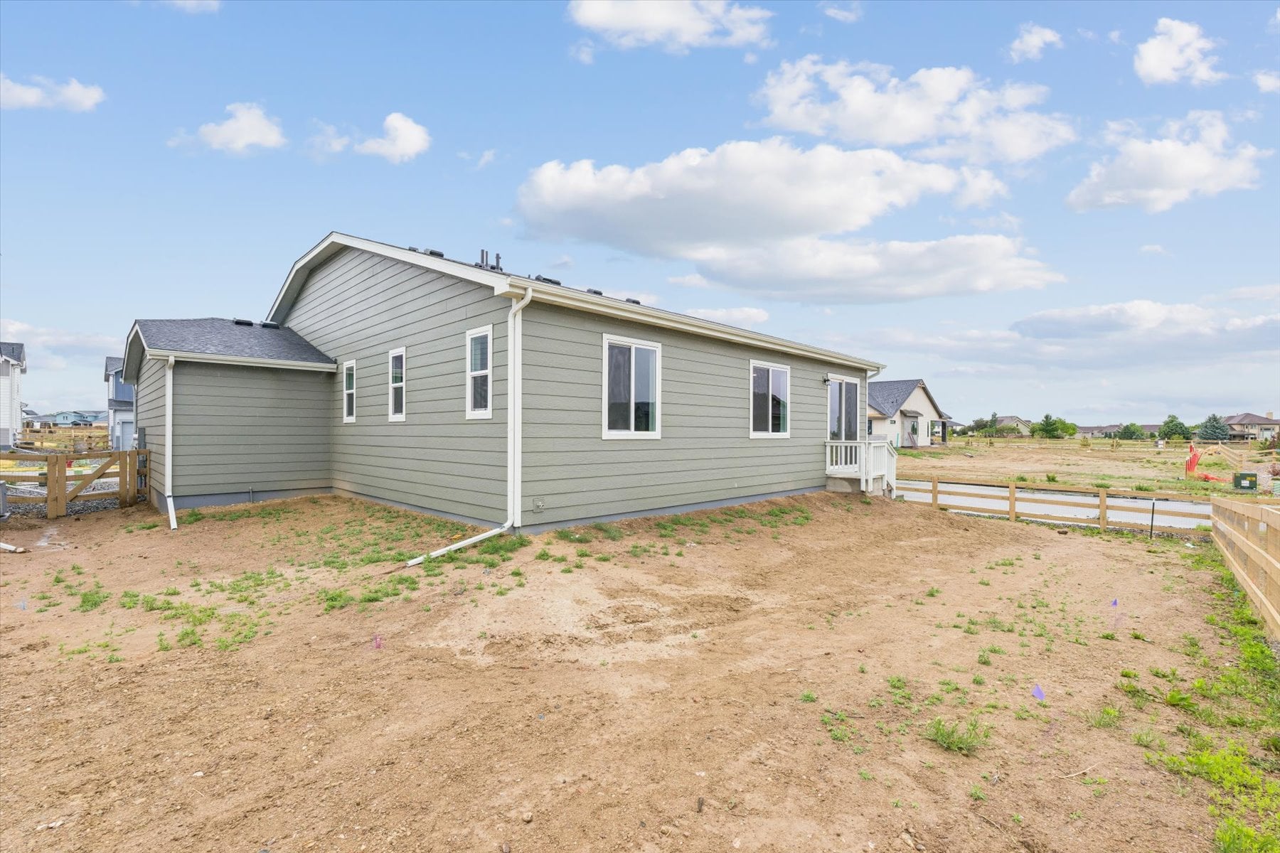 A house with a dirt road.