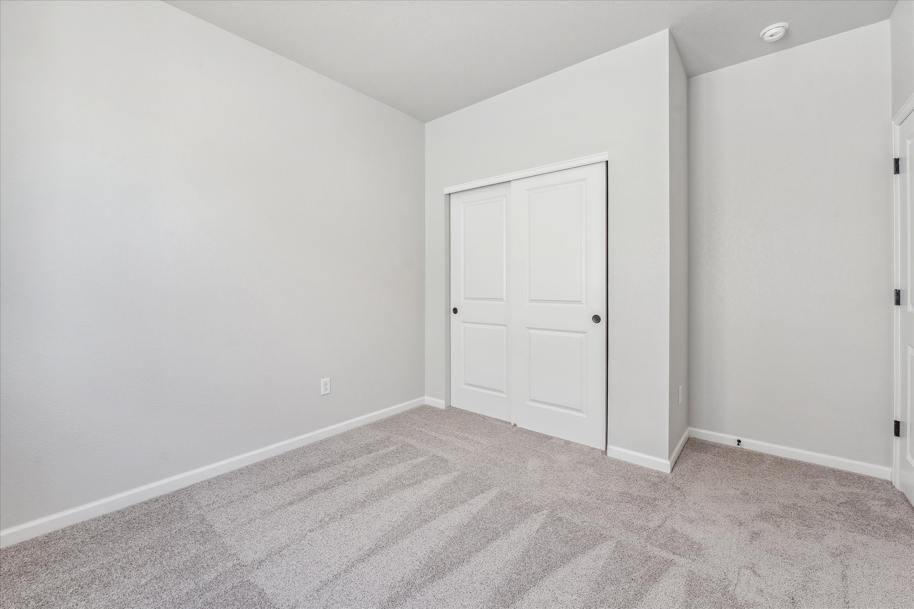 A room with white doors.