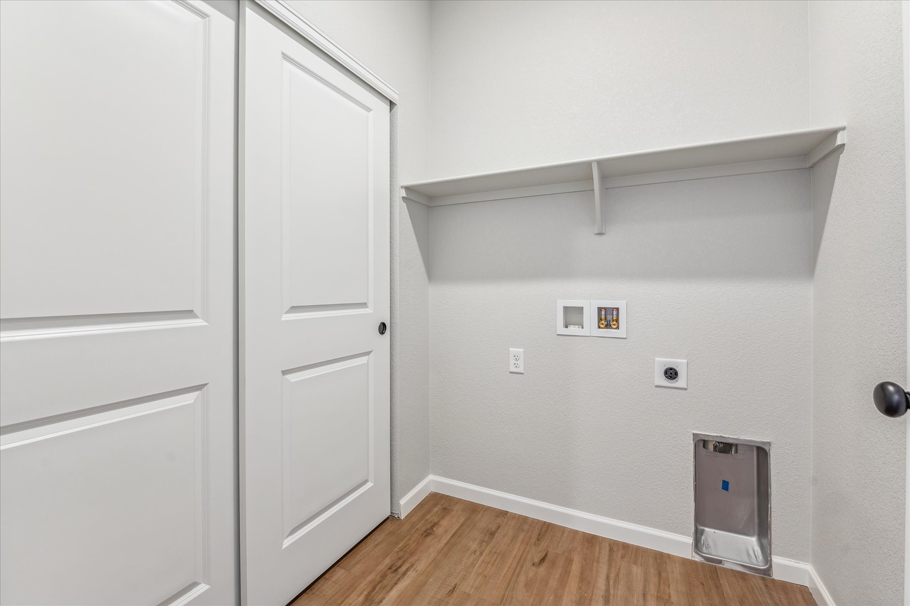 A room with white cabinets.