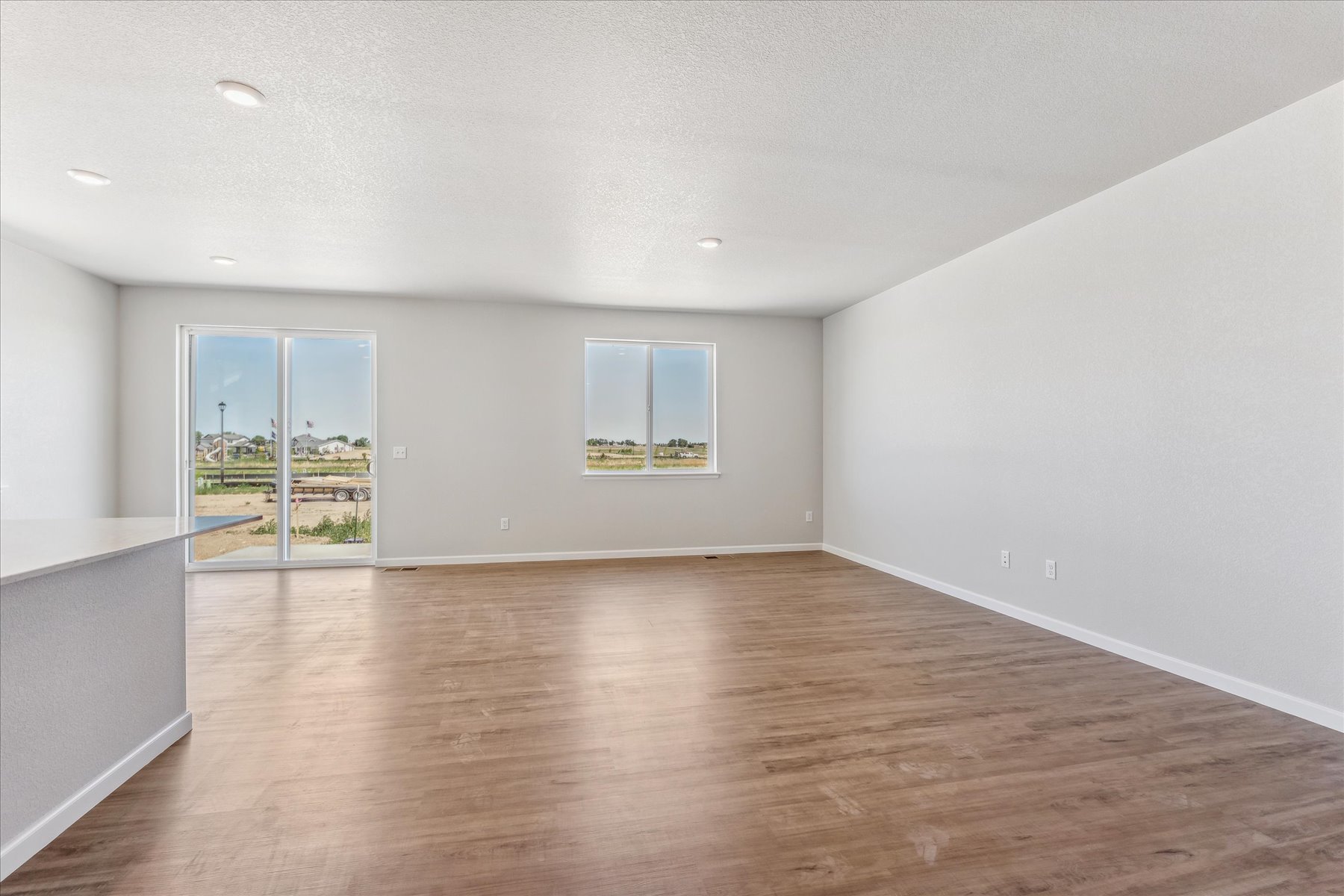 A room with a wood floor and a wood floor.