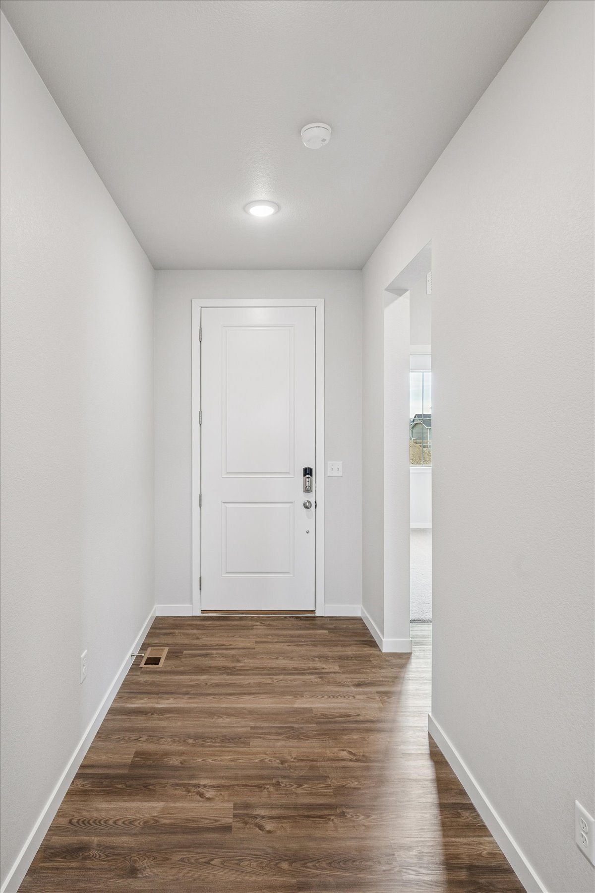 A hallway with white doors.