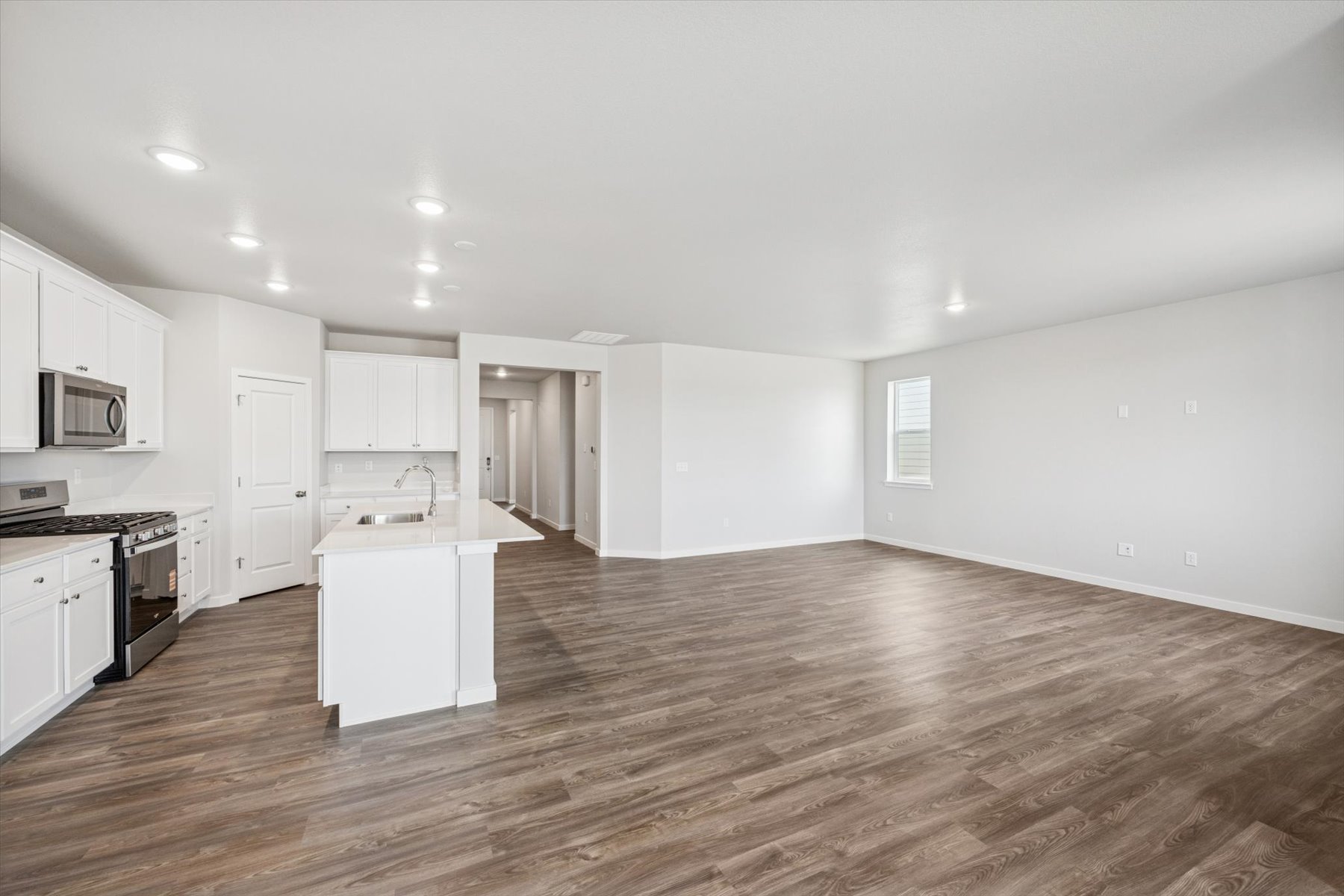 A large kitchen with white cabinets.