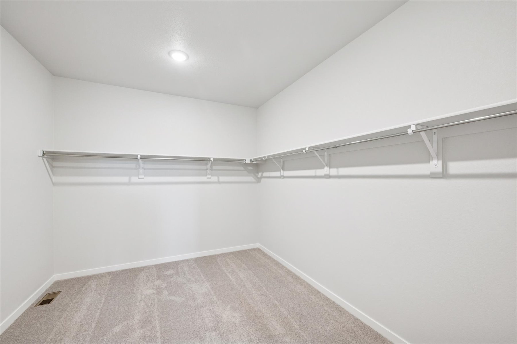 A white room with a staircase.