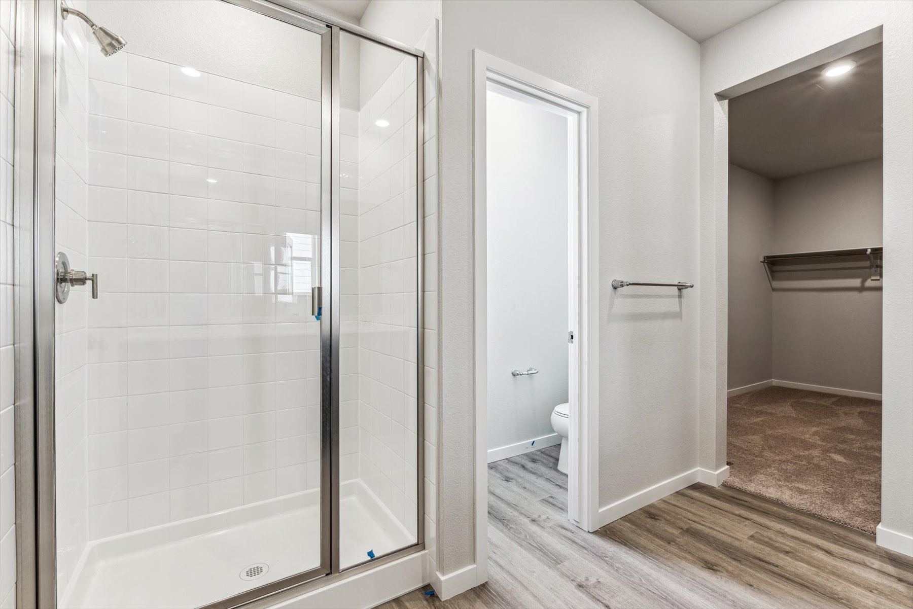 A bathroom with a glass shower.
