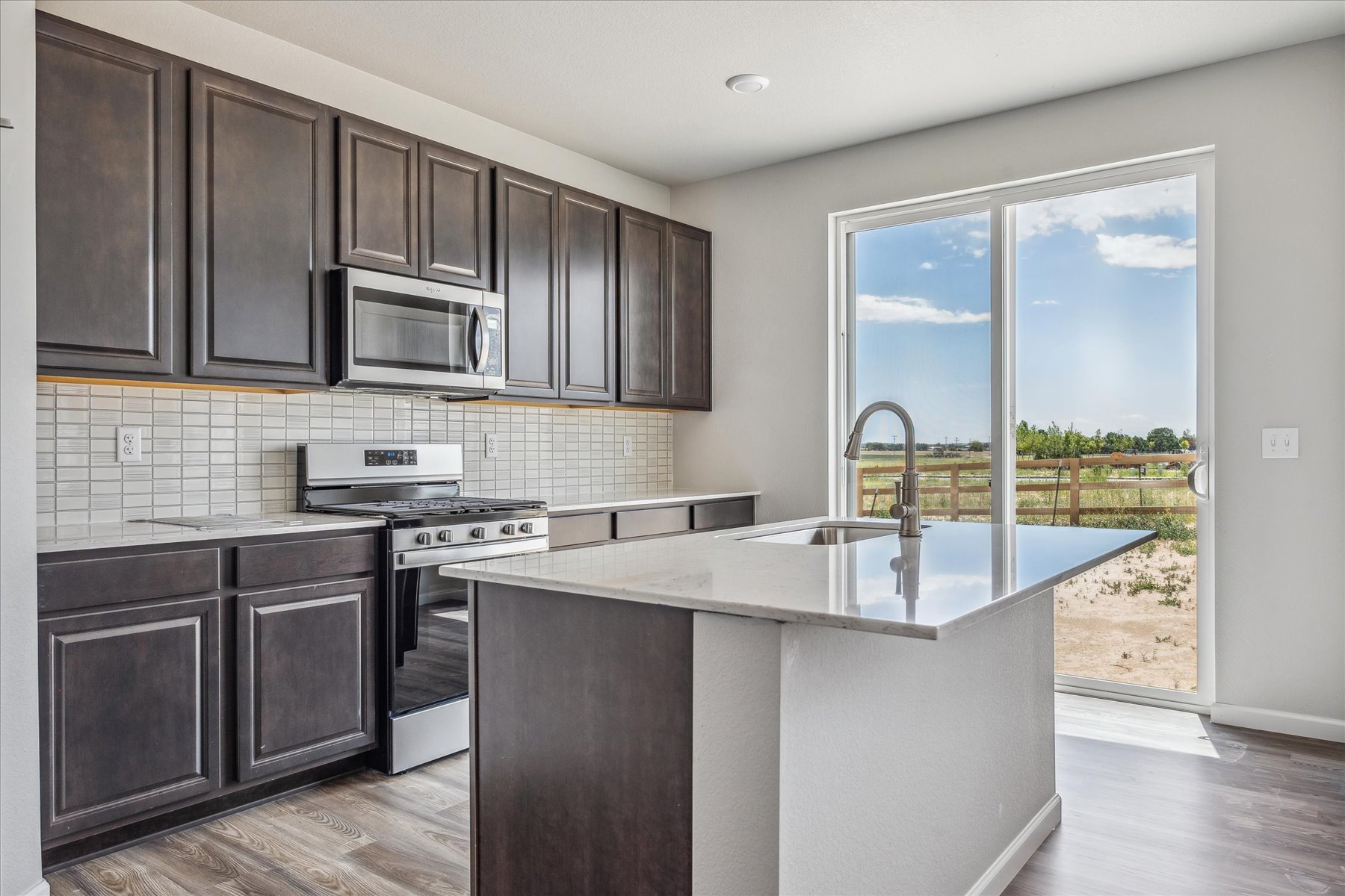 A kitchen with a large island.