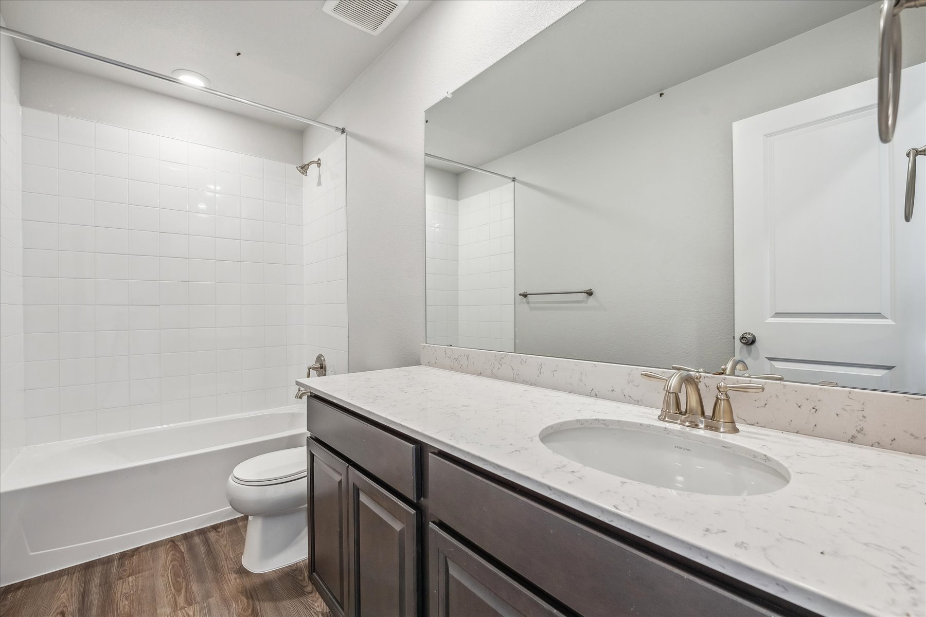 A bathroom with a sink and a toilet.