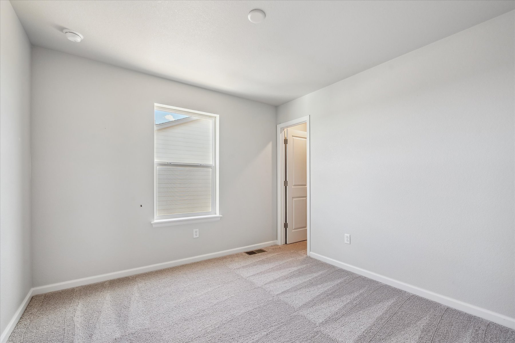 A room with a door and a window.