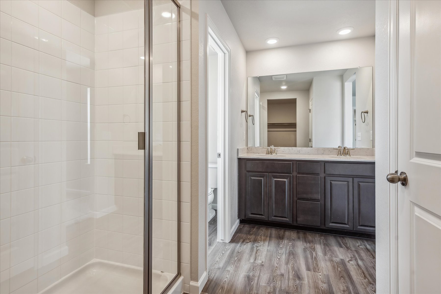 A bathroom with a glass shower.
