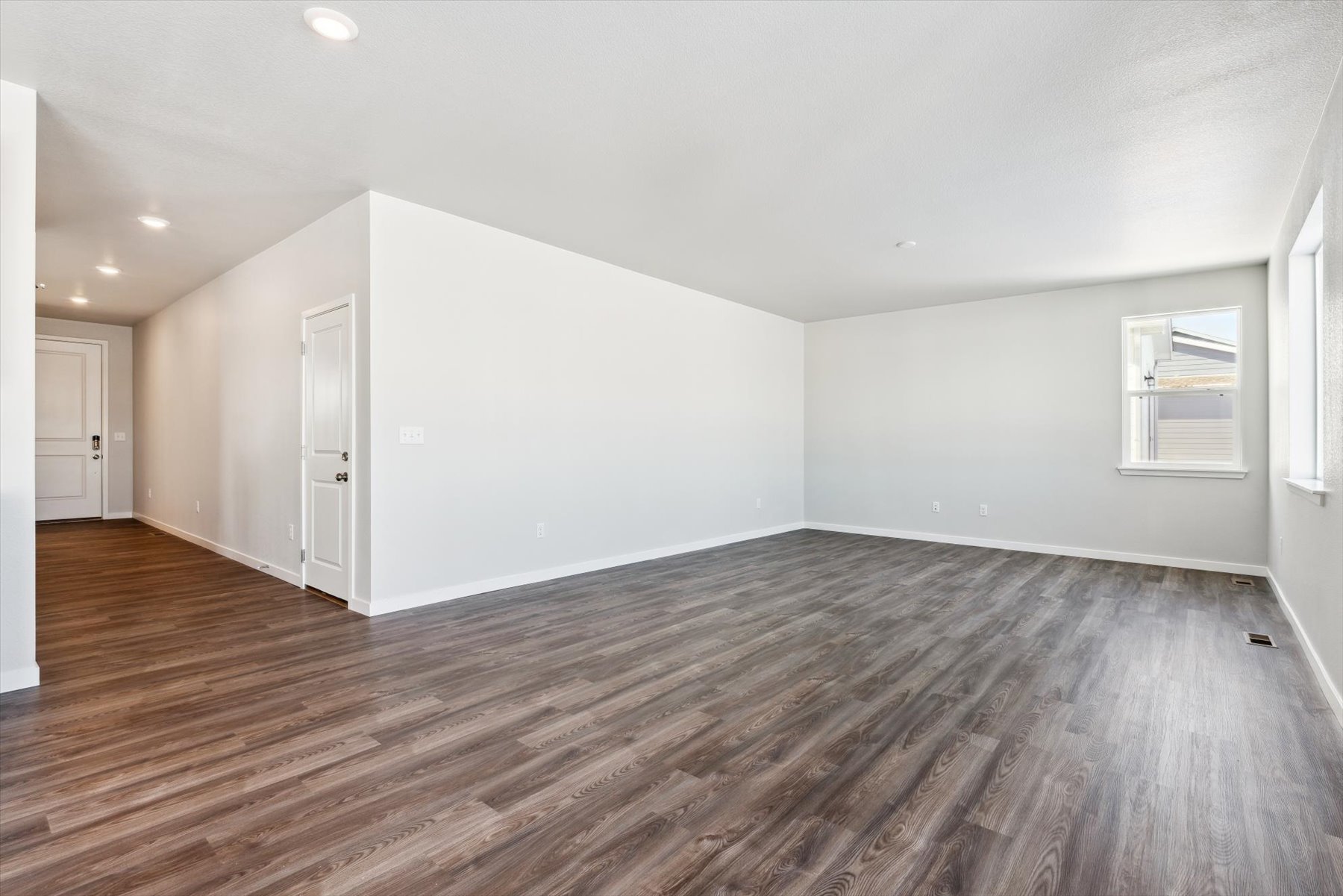 A room with a wood floor.