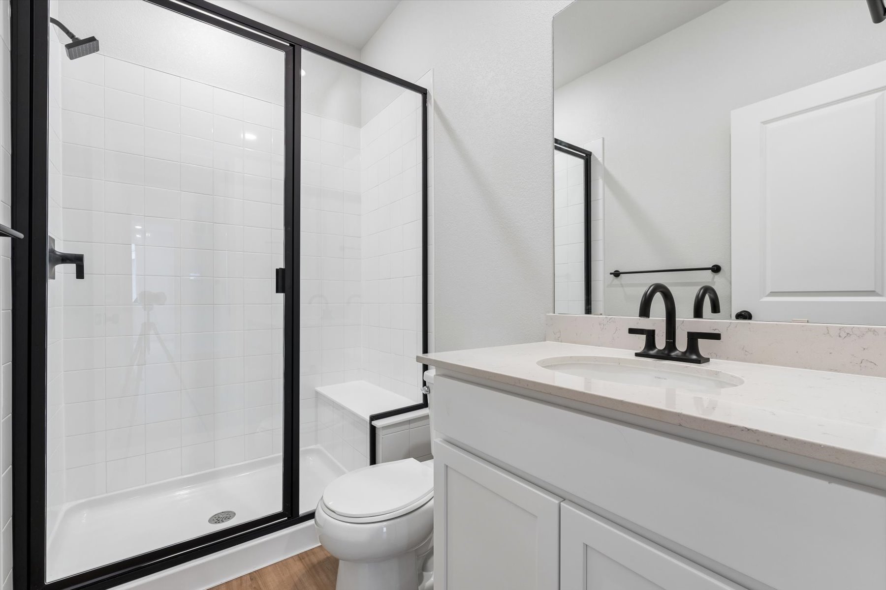 A bathroom with a glass shower.