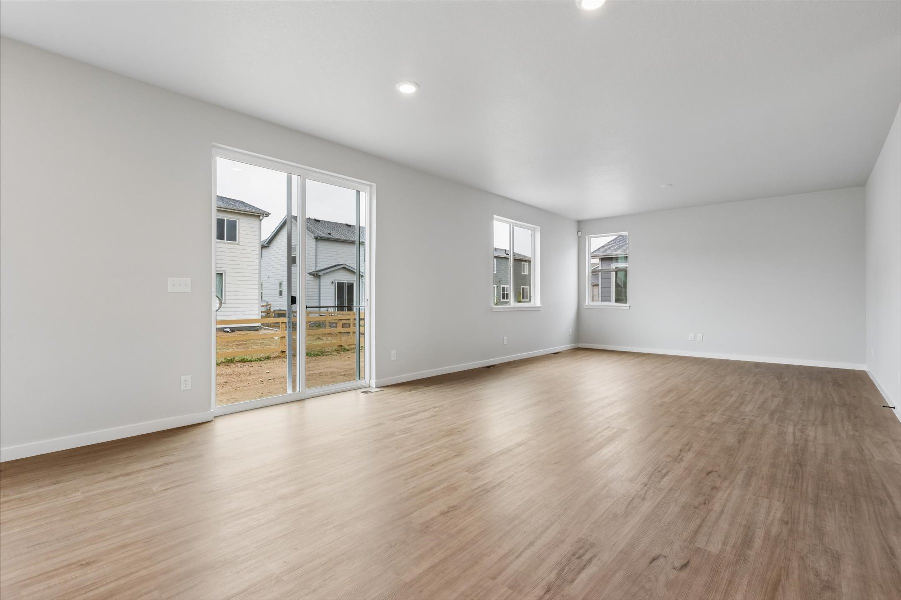 A room with a wood floor and a wood floor.