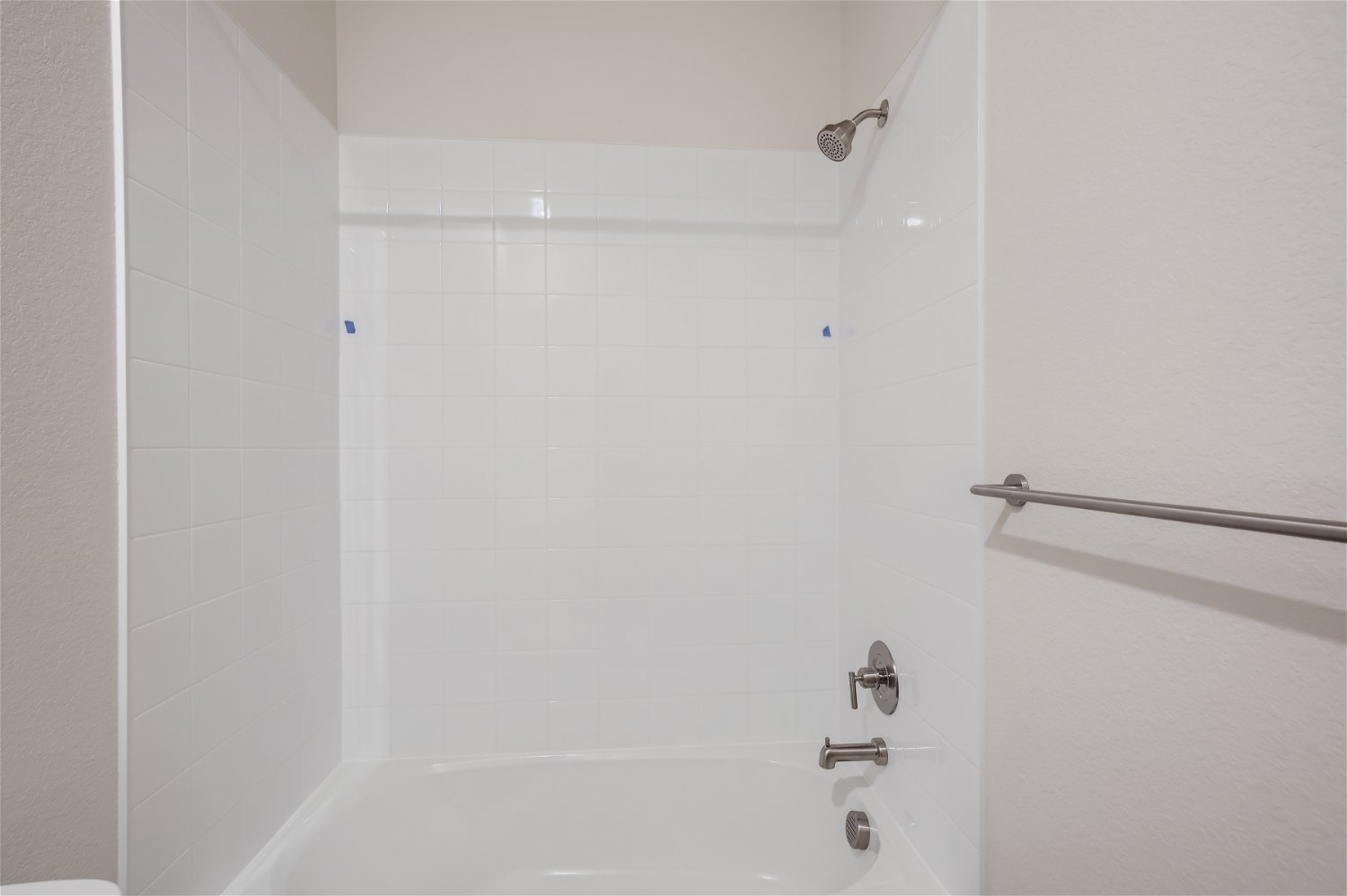 A bathtub in a bathroom.