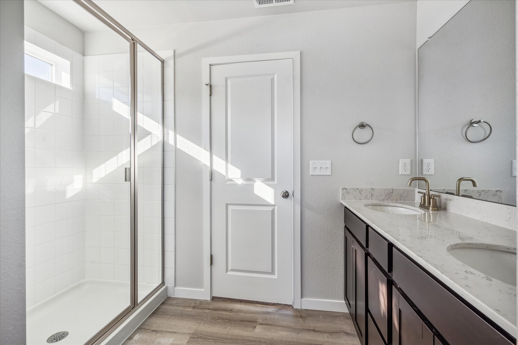 A bathroom with a glass shower.