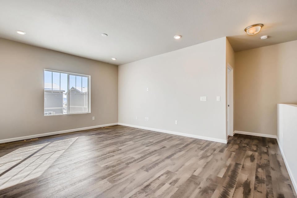 A room with a wood floor and a wood floor.