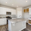 Whole kitchen of the Fraser floor plan by Century Communities