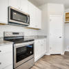 Kitchen counters and appliances of the Fraser floor plan by Century Communities