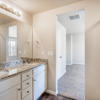 Primary suite private bath dual vanity of the Fraser floor plan by Century Communities
