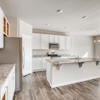 Open concept kitchen of the ranch style Palisade plan by Century Communities