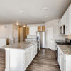 kitchen counters and island of the ranch style Palisade plan by Century Communities