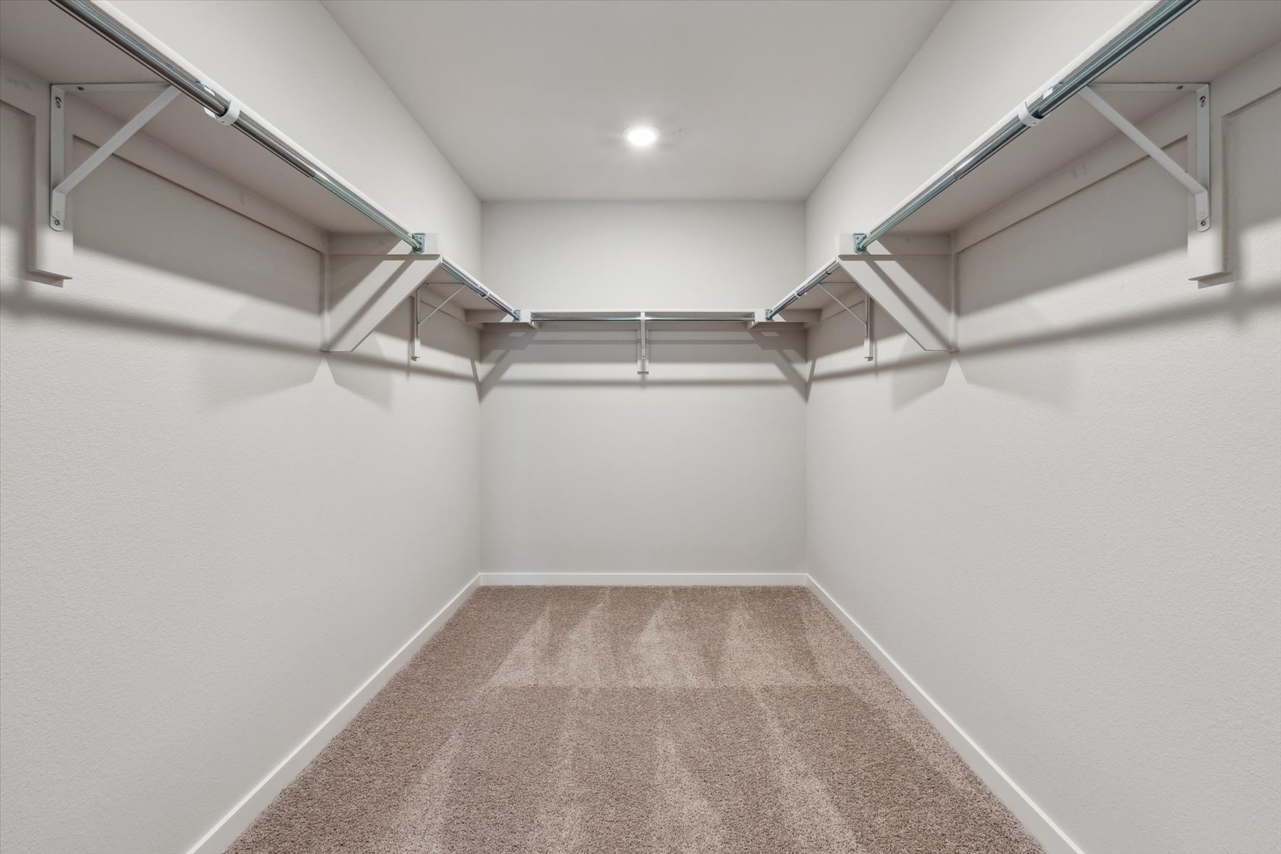 A hallway with white walls.