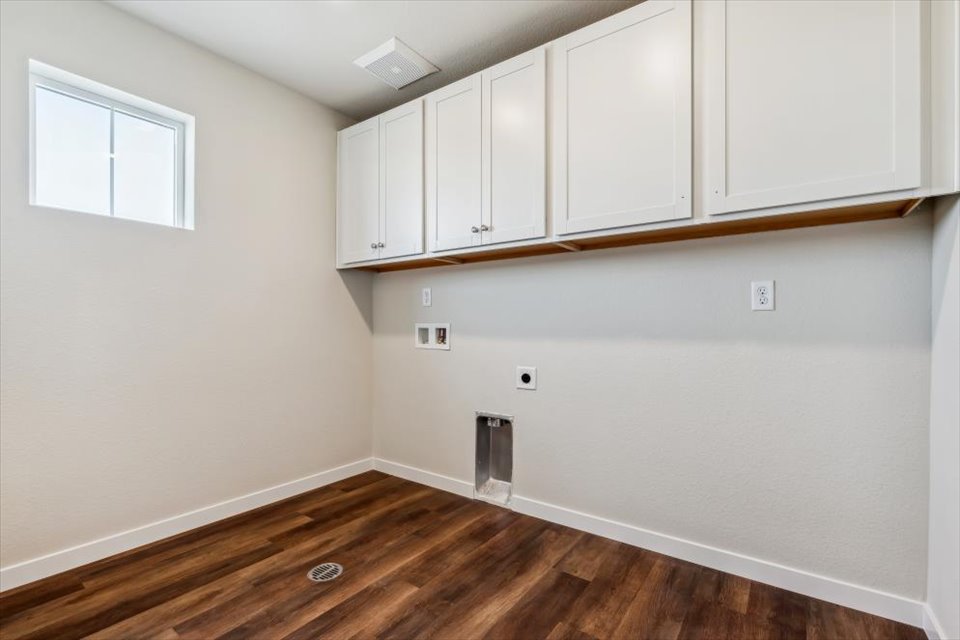 A room with white cabinets.