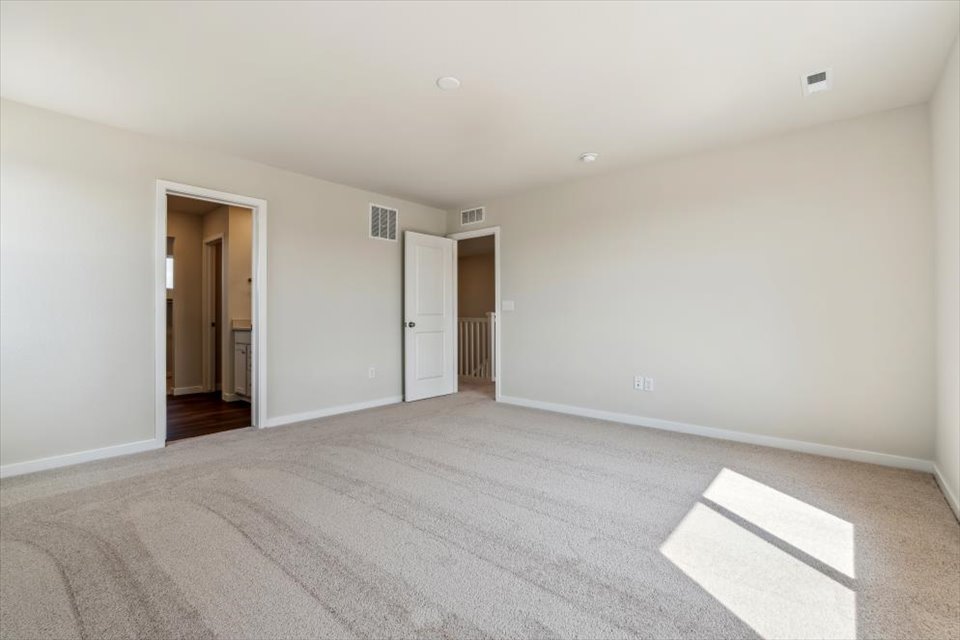 A hallway with white walls.