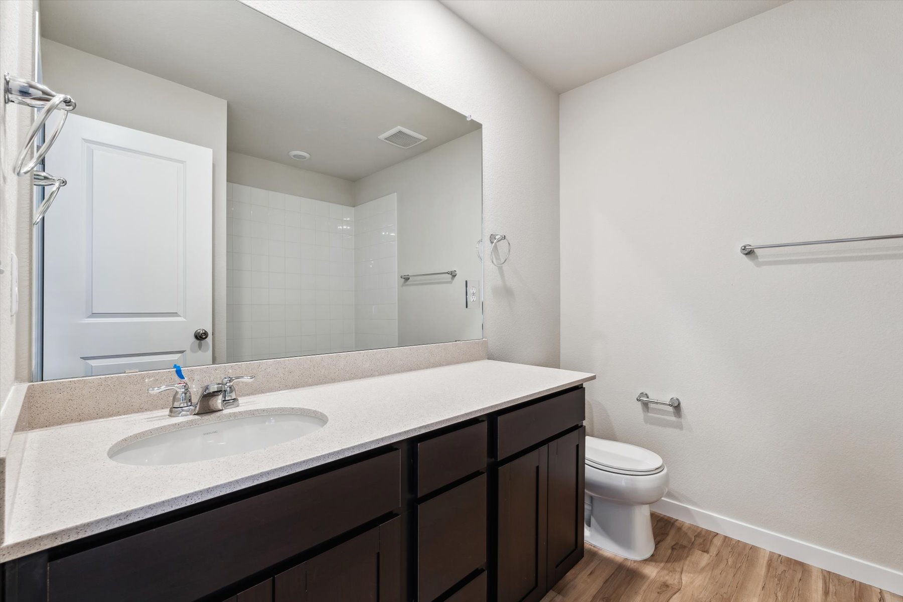A bathroom with a sink and a toilet.
