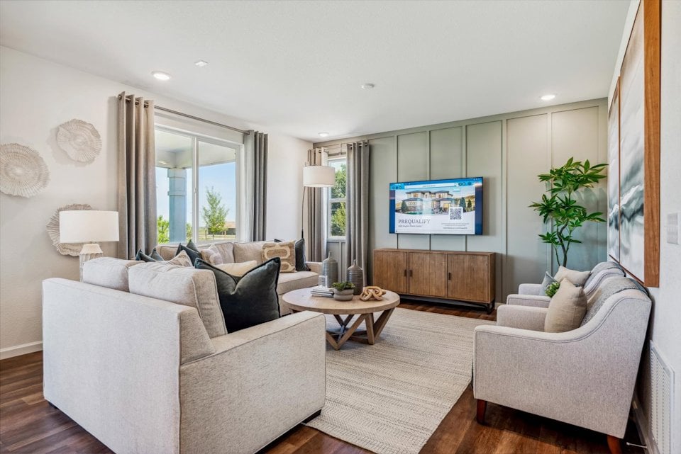 A living room with a tv and couches.