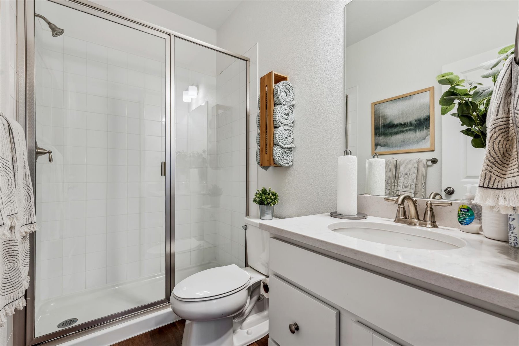 A bathroom with a glass shower.