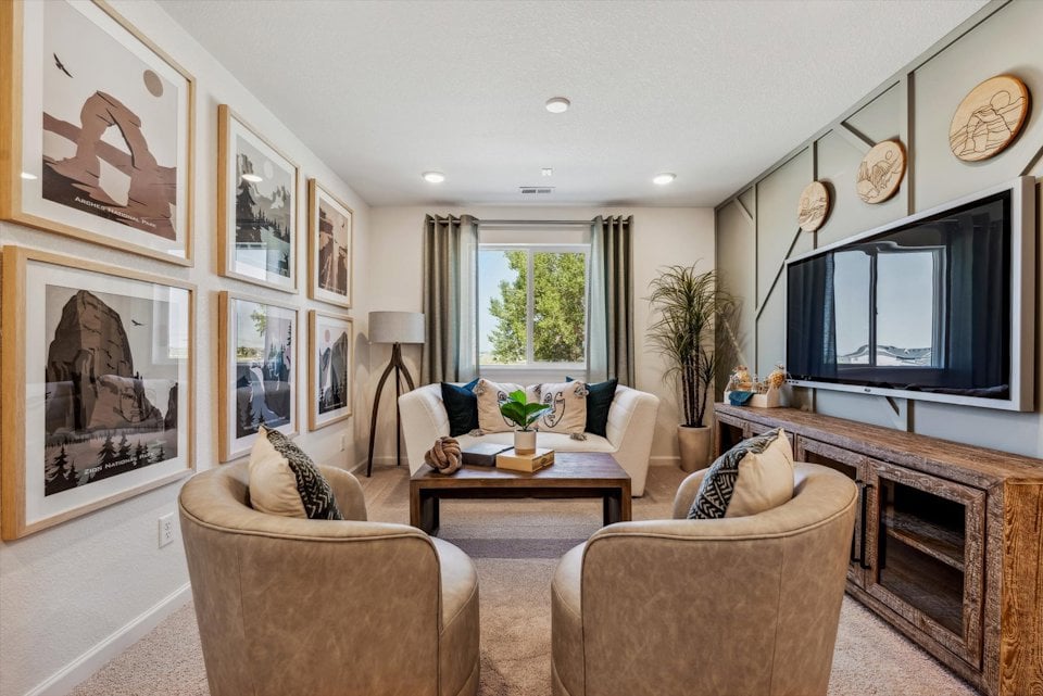 A living room with a tv and couches.