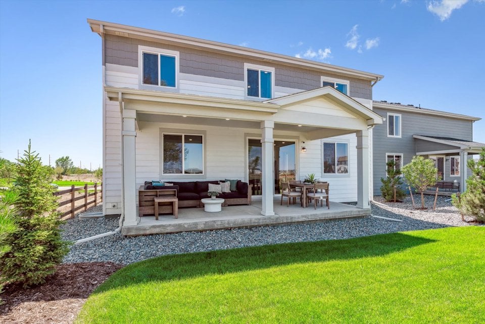 A house with a patio and a lawn.