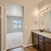 Owner's dual vanity and shower of the ranch style Telluride plan by Century Communities