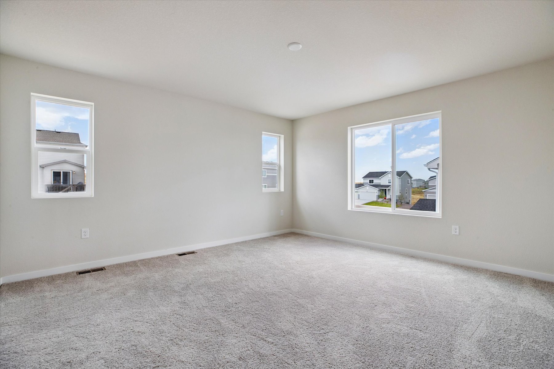 A room with a few paintings on the wall.