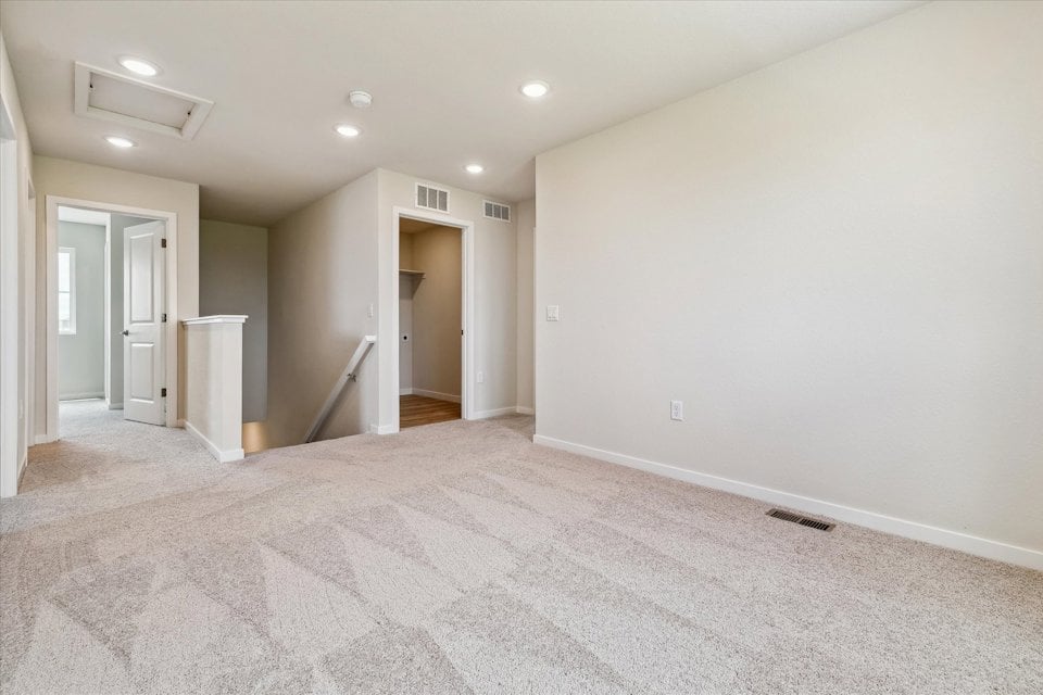 A hallway with white walls.