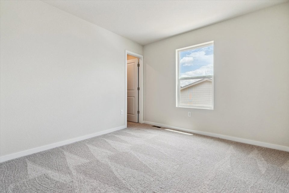 A hallway with a painting on the wall.