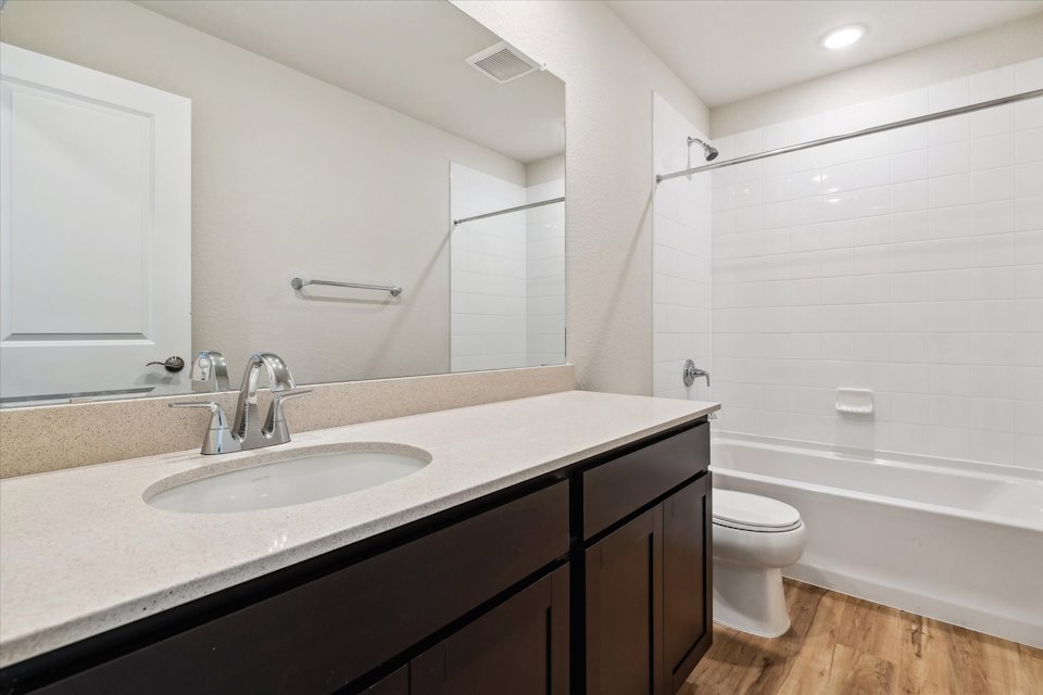 A bathroom with a sink and a toilet.