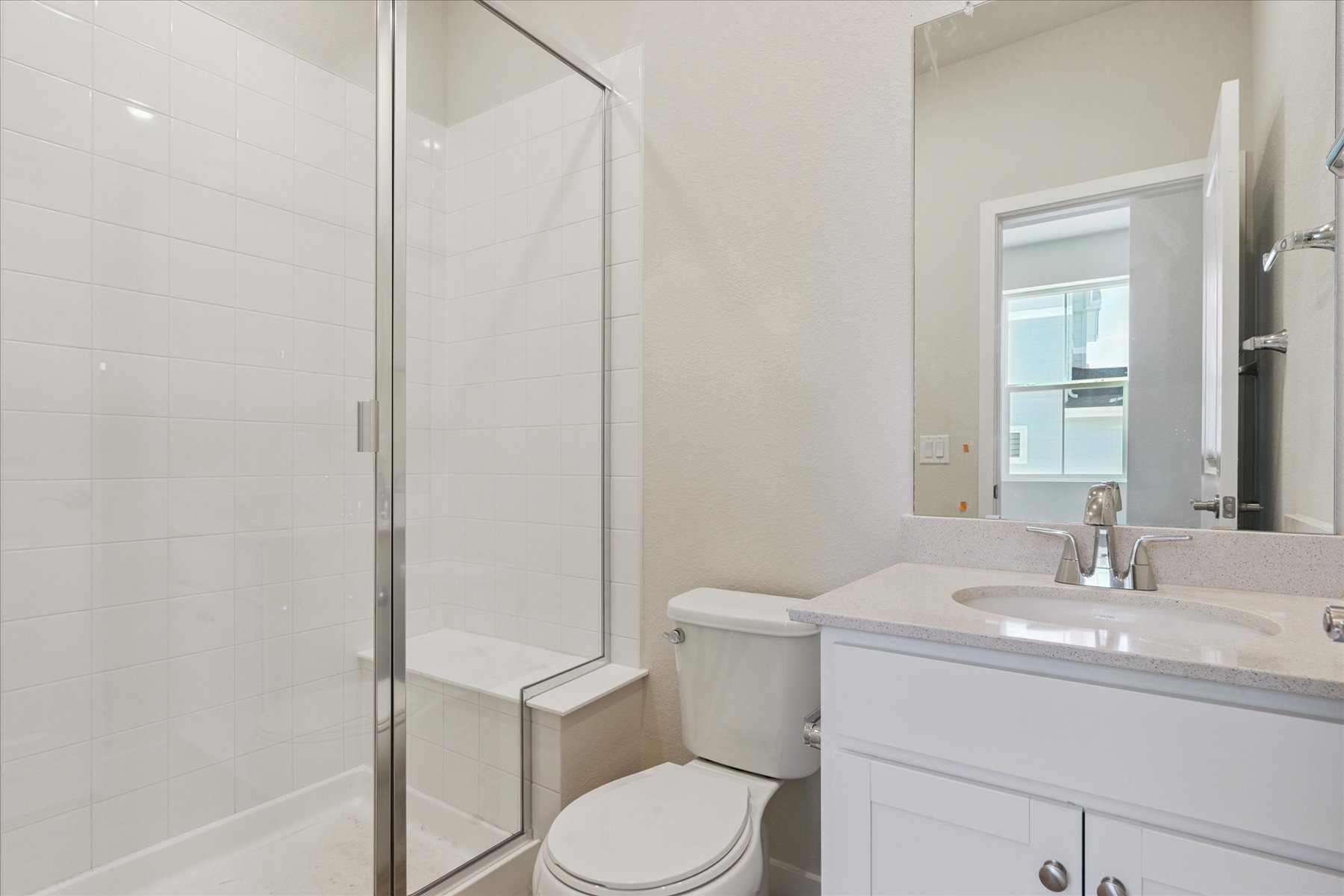 A bathroom with a glass shower.