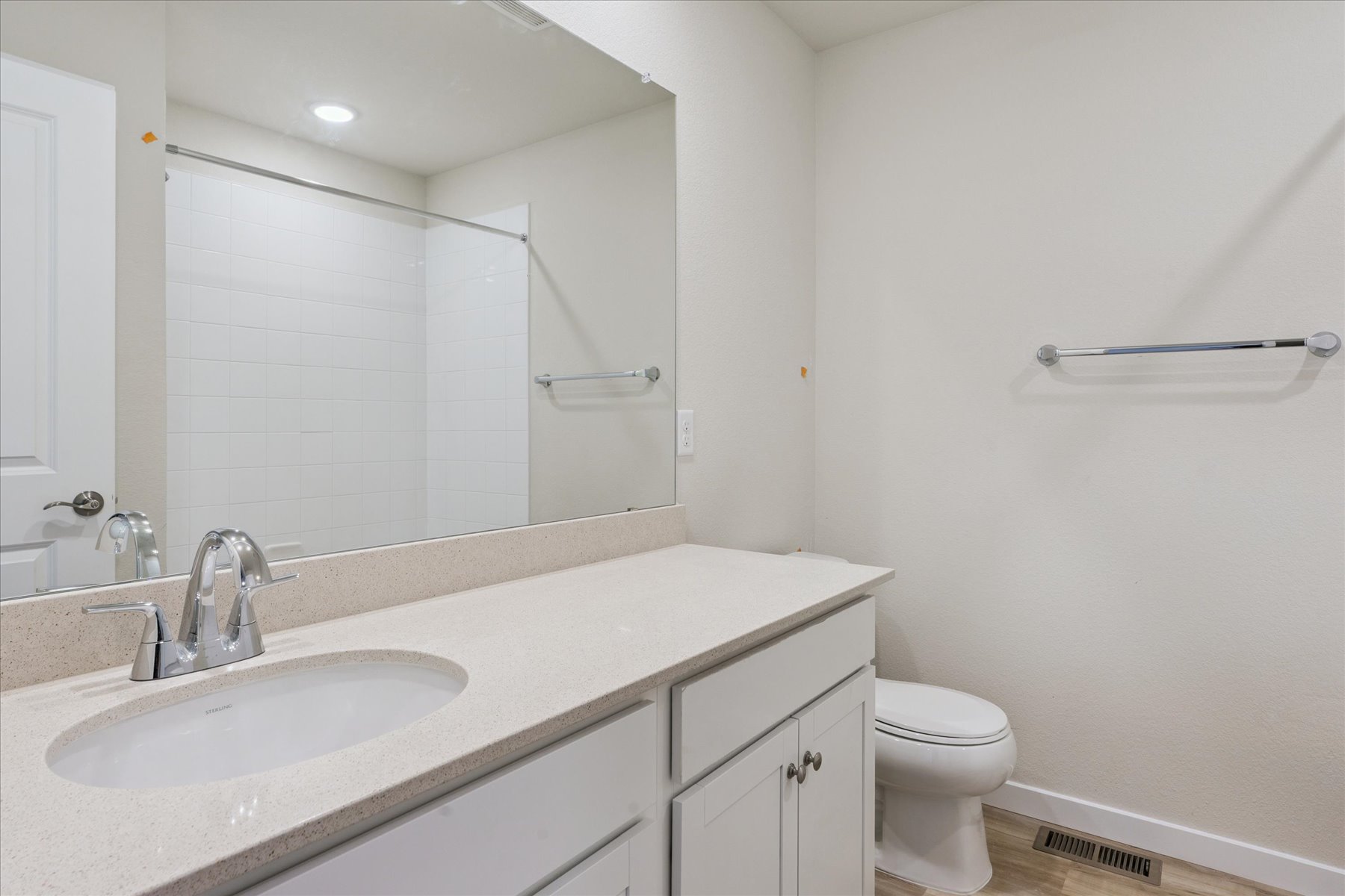 A bathroom with a sink and a toilet.
