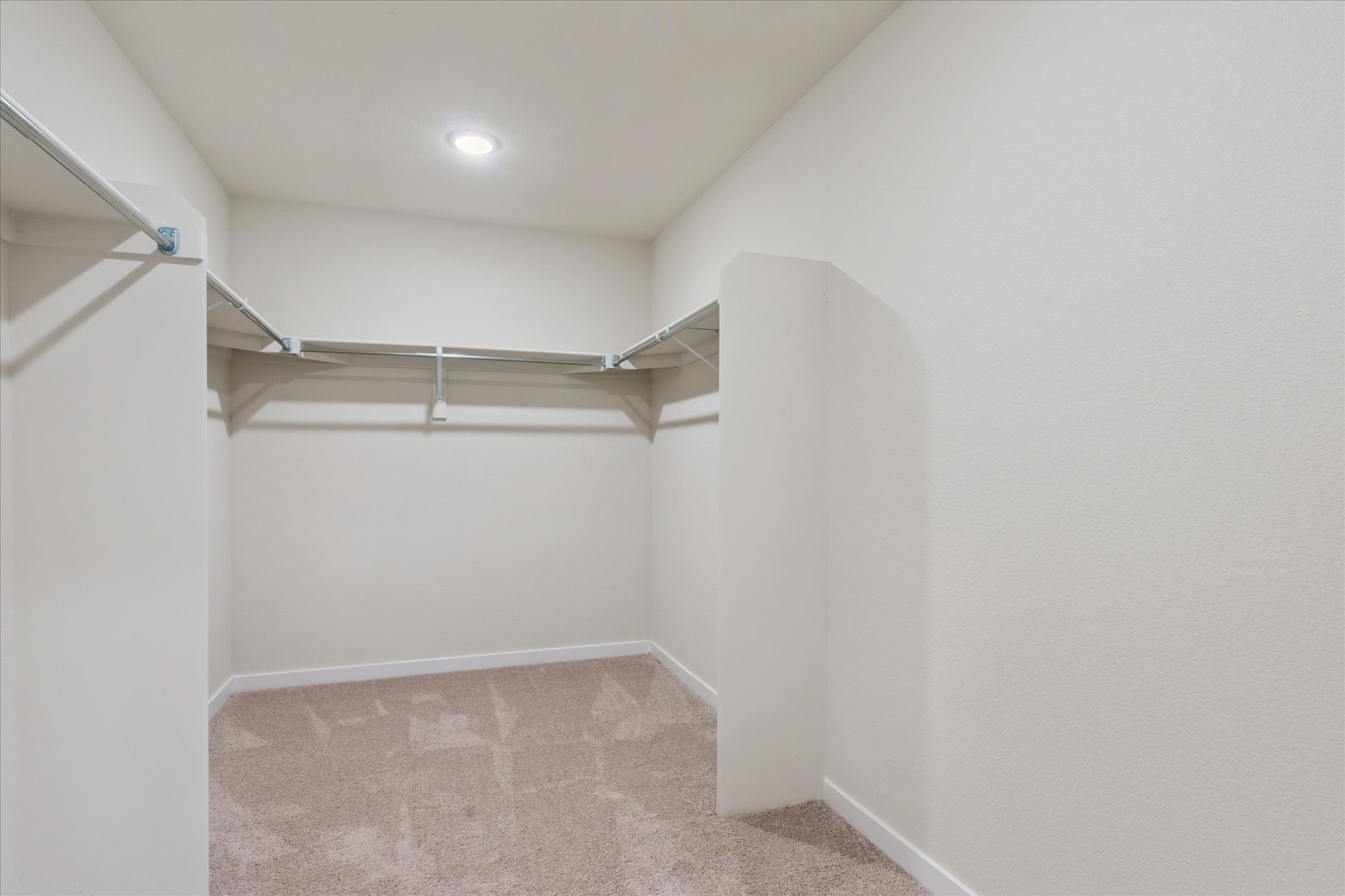 A hallway with white walls.