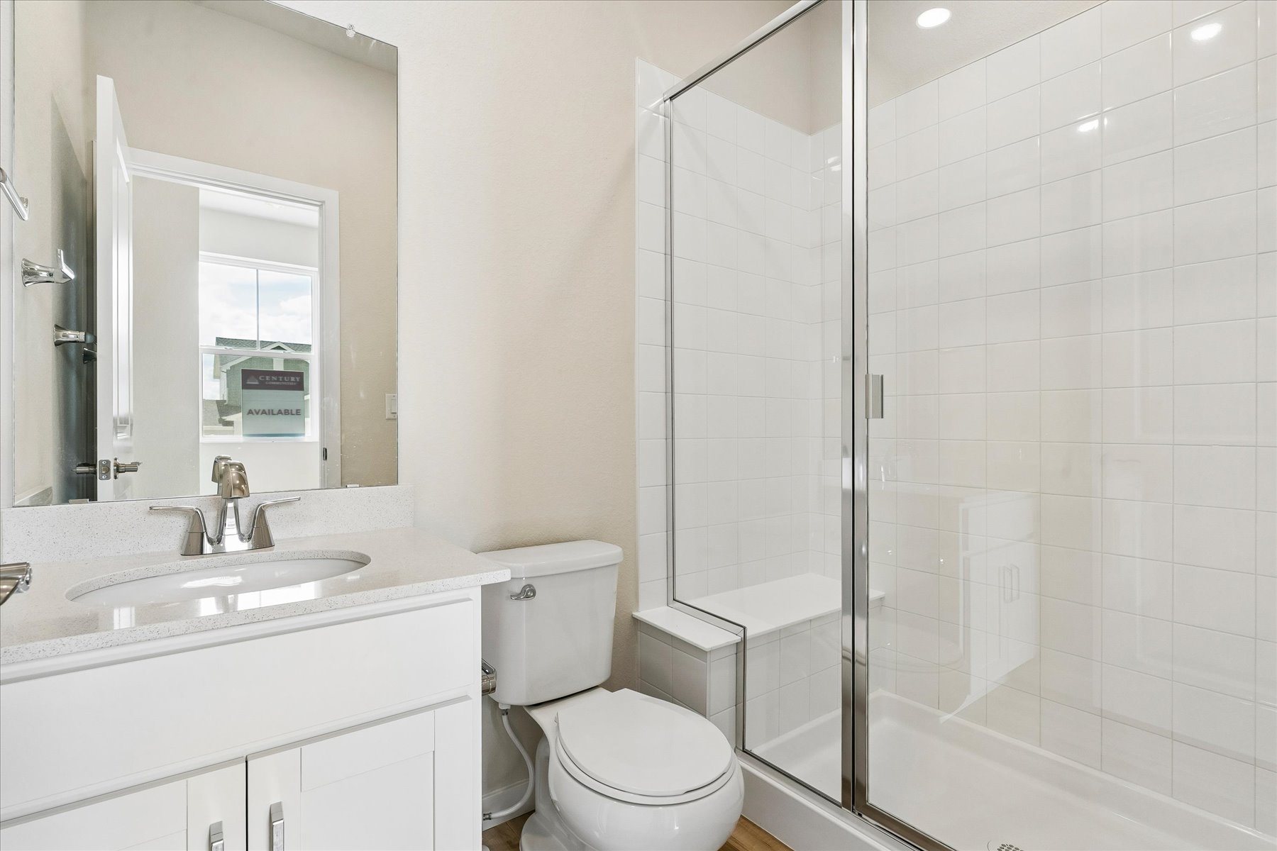 A bathroom with a glass shower.