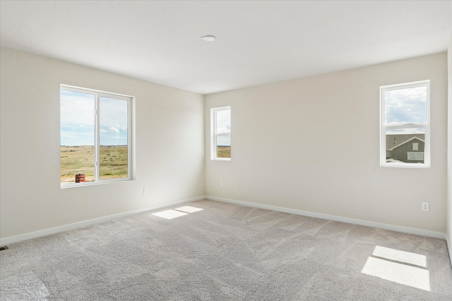 A room with a few windows.