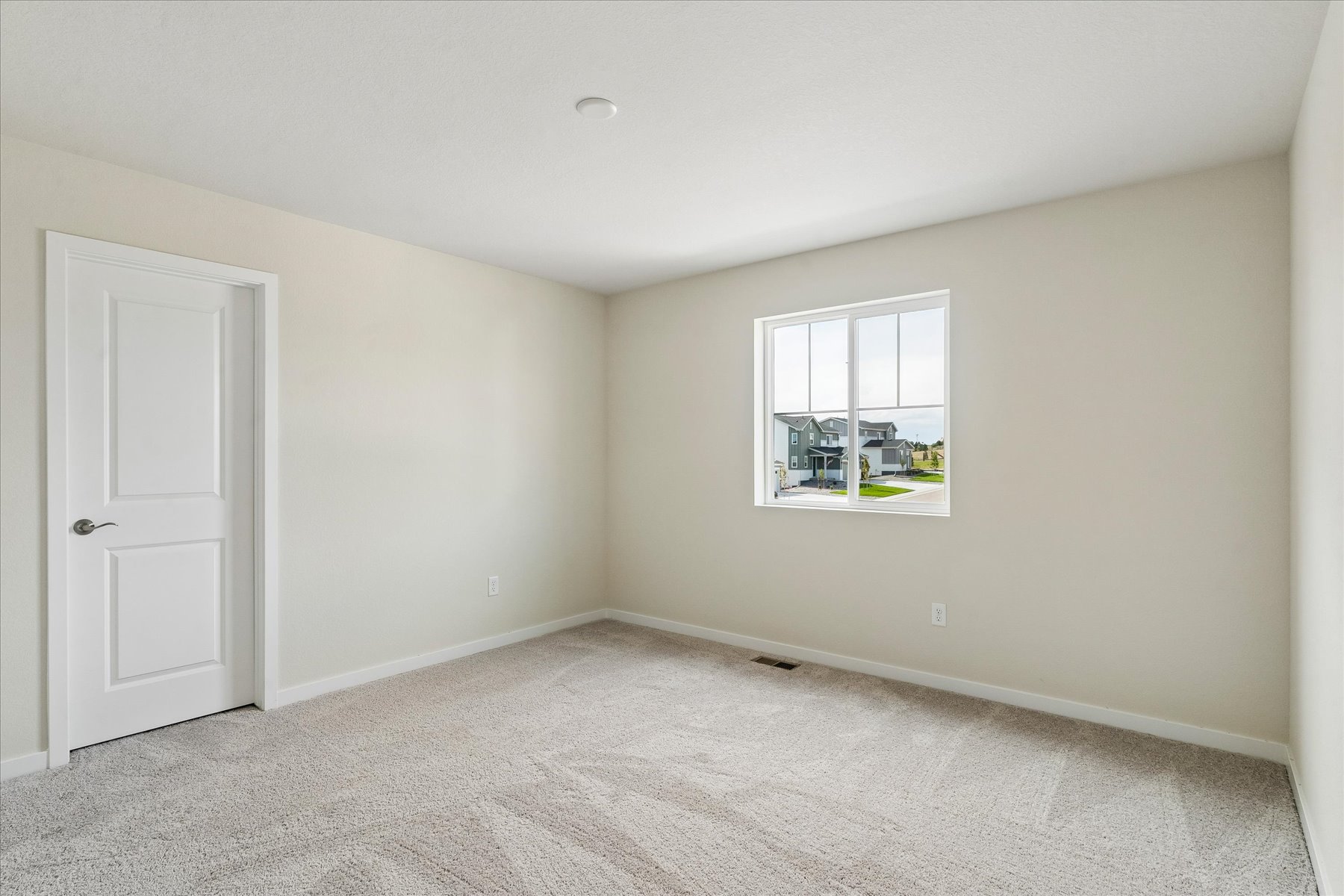 A room with a door and a window.